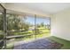Spacious screened porch overlooking a tranquil pond at 3 Quails Run Blvd # 8, Englewood, FL 34223