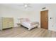 Bedroom with double bed, dresser, and light flooring at 3 Quails Run Blvd # 8, Englewood, FL 34223