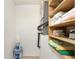 Small laundry room with shelving and storage at 3 Quails Run Blvd # 8, Englewood, FL 34223