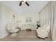 Living room with two comfy armchairs and a sofa at 3 Quails Run Blvd # 8, Englewood, FL 34223