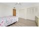 Bedroom with double bed and ample closet space at 3 Quails Run Blvd # 8, Englewood, FL 34223