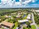 Aerial view showcasing condo building's location within community at 3 Quails Run Blvd # 8, Englewood, FL 34223
