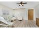 Bright living room featuring light flooring and comfy seating at 3 Quails Run Blvd # 8, Englewood, FL 34223