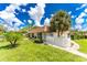 Condo community building with landscaped grounds at 3 Quails Run Blvd # 8, Englewood, FL 34223