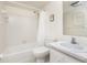 Clean bathroom with shower/tub combo and white vanity at 3 Quails Run Blvd # 8, Englewood, FL 34223