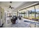 Spacious sunroom with ample seating and views of the backyard at 9273 Carnation Ave, Englewood, FL 34224