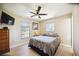 Cozy bedroom with a double bed and a ceiling fan at 9273 Carnation Ave, Englewood, FL 34224