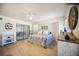 Main bedroom with king-size bed and access to a private patio at 9273 Carnation Ave, Englewood, FL 34224
