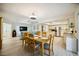 Dining area with table and chairs, open to kitchen and living room at 9273 Carnation Ave, Englewood, FL 34224