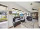 Relaxing sunroom boasting comfortable seating and access to the backyard at 9273 Carnation Ave, Englewood, FL 34224