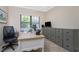 Bright home office features a large desk and ample storage at 1418 Backspin Dr, Englewood, FL 34223