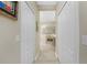 View down hallway to a large bathroom at 1418 Backspin Dr, Englewood, FL 34223