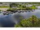 Aerial view of community with marina and waterfront access at 130 Nautical Dr, North Port, FL 34287