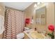 Second bathroom with shower/tub combo, vanity, and mirror at 130 Nautical Dr, North Port, FL 34287