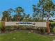 The entrance to Harbor Isles community features a well-maintained landscape and signage at 130 Nautical Dr, North Port, FL 34287