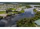 Community aerial showcasing waterfront property and boat docks at 130 Nautical Dr, North Port, FL 34287