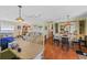 Open kitchen with a breakfast bar and view of the dining and living room areas at 130 Nautical Dr, North Port, FL 34287