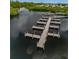 Aerial view of community boat docks extending over the water at 130 Nautical Dr, North Port, FL 34287