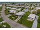Aerial view of a large community with many mobile homes and lush landscaping at 130 Nautical Dr, North Port, FL 34287