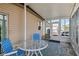 Covered porch with glass enclosure, table, and chairs. Perfect for outdoor dining at 130 Nautical Dr, North Port, FL 34287