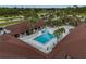 Aerial view of a community pool with surrounding lounge chairs at 130 Nautical Dr, North Port, FL 34287