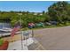 Community kayak storage area with various kayaks and a US flag at 130 Nautical Dr, North Port, FL 34287