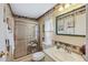 Clean bathroom with walk-in shower, toilet, and vanity at 130 Nautical Dr, North Port, FL 34287