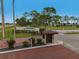 Gated community entrance with brick pavers and landscaping at 130 Nautical Dr, North Port, FL 34287