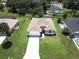 Single-story house with driveway and green lawn at 35 Mark Twain Ln, Rotonda West, FL 33947