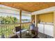 Balcony with a table and chairs, plus a view of the water at 2375 N Beach Rd # 3A, Englewood, FL 34223
