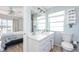 Clean bathroom with white vanity and shower/tub combo at 2375 N Beach Rd # 3A, Englewood, FL 34223