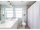 Bathroom with white vanity, tiled floor, and shower at 2375 N Beach Rd # 3A, Englewood, FL 34223