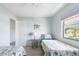 Bedroom with two twin beds and ocean view at 2375 N Beach Rd # 3A, Englewood, FL 34223
