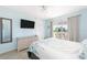Bedroom with water view, dresser, and king-size bed at 2375 N Beach Rd # 3A, Englewood, FL 34223