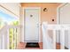 Condo entrance with white door and welcome mat at 2375 N Beach Rd # 3A, Englewood, FL 34223