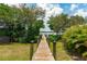 Wooden dock leading to the water at 2375 N Beach Rd # 3A, Englewood, FL 34223