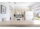 Bright kitchen features white appliances and ample counter space at 2375 N Beach Rd # 3A, Englewood, FL 34223