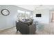 Living room with gray sofas and a view at 2375 N Beach Rd # 3A, Englewood, FL 34223