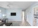 Living room with gray sofas and kitchen view at 2375 N Beach Rd # 3A, Englewood, FL 34223