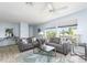 Relaxing living room featuring two sofas, wood-look floors, and water views at 2375 N Beach Rd # 3A, Englewood, FL 34223