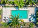 Aerial view of community pool with lounge chairs at 2375 N Beach Rd # 3A, Englewood, FL 34223