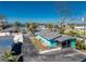 Exterior view of a charming blue home, featuring a screened porch and nearby waterfront access at 470 S Mccall Rd # 10, Englewood, FL 34223