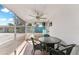 Screened-in porch with tile floor and view of the exterior of the condominium complex at 470 S Mccall Rd # 10, Englewood, FL 34223