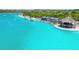 Fantastic aerial view of lagoon, featuring beachside cabanas, and a swim-up bar at 7537 Pool Compass Loop, Wesley Chapel, FL 33545