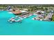 Incredible aerial view of lagoon, showcasing floating cabanas, beachside lounging, and an outdoor bar at 7537 Pool Compass Loop, Wesley Chapel, FL 33545