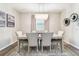 Elegant dining room with a modern chandelier and stylish decor at 7537 Pool Compass Loop, Wesley Chapel, FL 33545