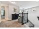 Upstairs landing with a decorative lighting fixture and a seating area at 7537 Pool Compass Loop, Wesley Chapel, FL 33545