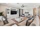 Spacious living room featuring built-in shelving, comfortable seating, and a stylish coffee table at 7537 Pool Compass Loop, Wesley Chapel, FL 33545