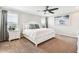 Serene main bedroom with ample natural light, a plush bed, and tasteful decor at 7537 Pool Compass Loop, Wesley Chapel, FL 33545
