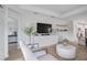 Bright and airy living room features hardwood flooring and modern furniture at 1352 Sunset Preserve Way, Port Charlotte, FL 33953